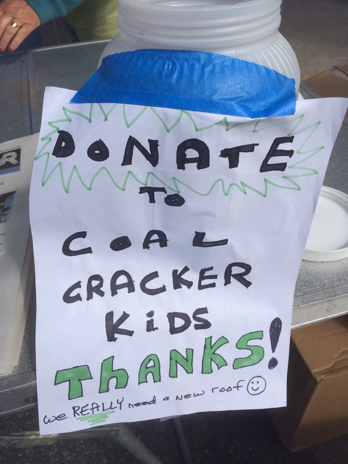 Photo of a donation jar for Coal Cracker Kids.