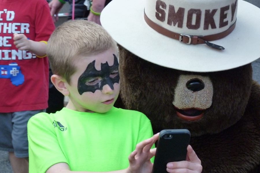 Photo of Smokey Bear and a child at National Night Out in Ashland, PA.